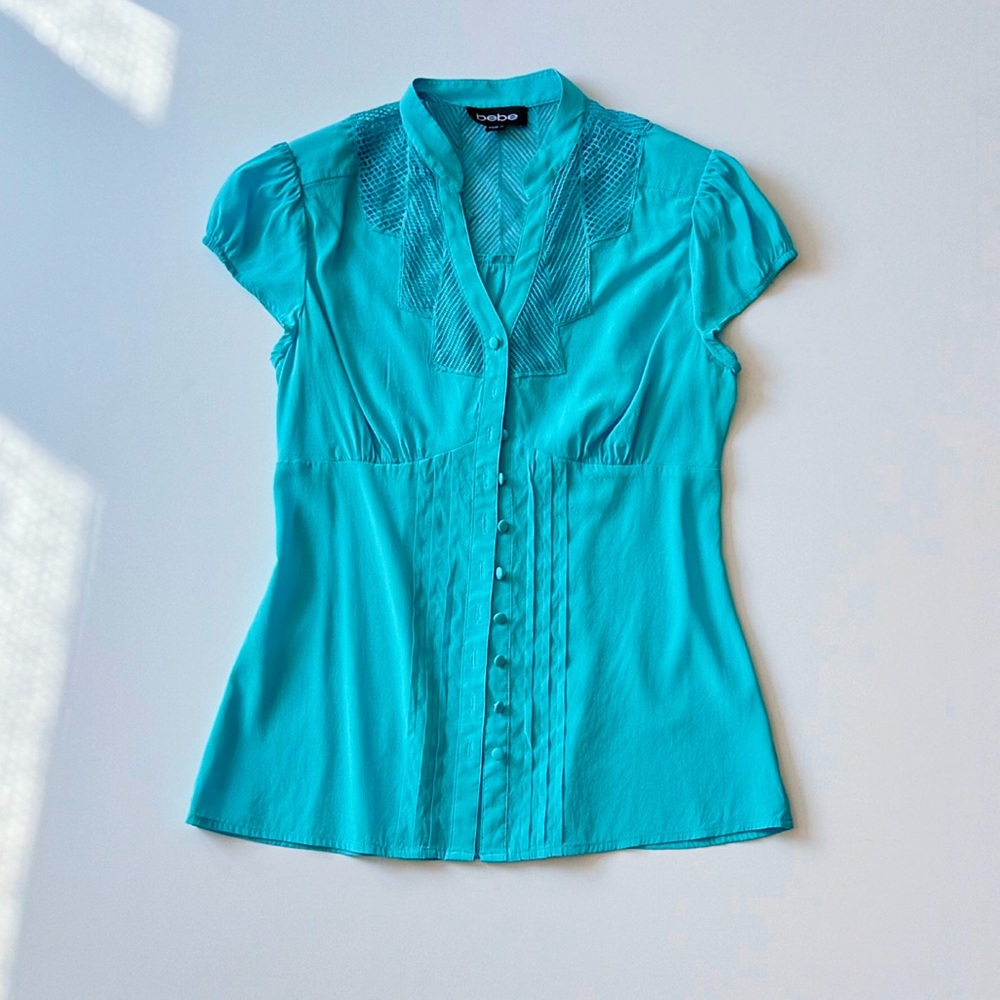 Fitted Vibrant Turquoise Blouse with Lace Detail and Shoulder Pads.